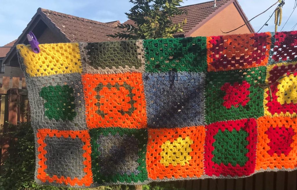 blanket with squares and grey border